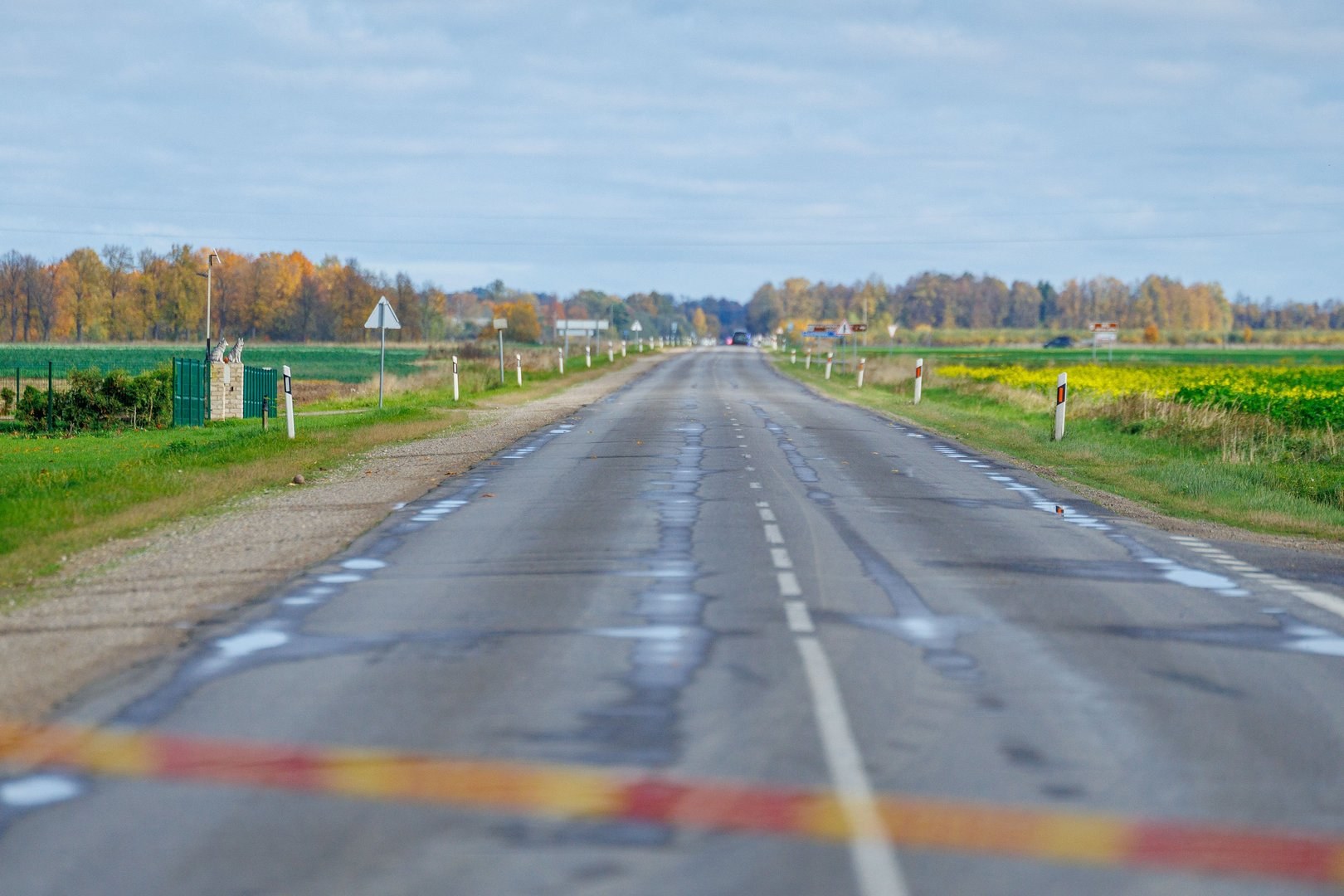 Road closed with police tape near the drone debris search in Pasvalys district