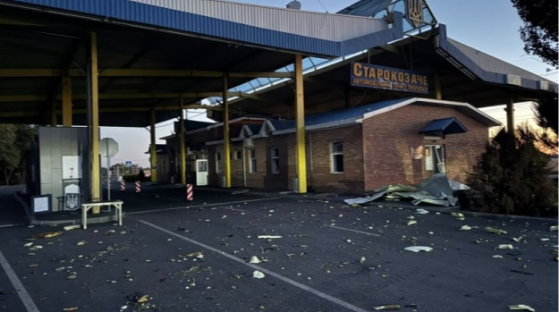 Debris scattered across the Starokozache checkpoint forecourt, its canopy roof torn open