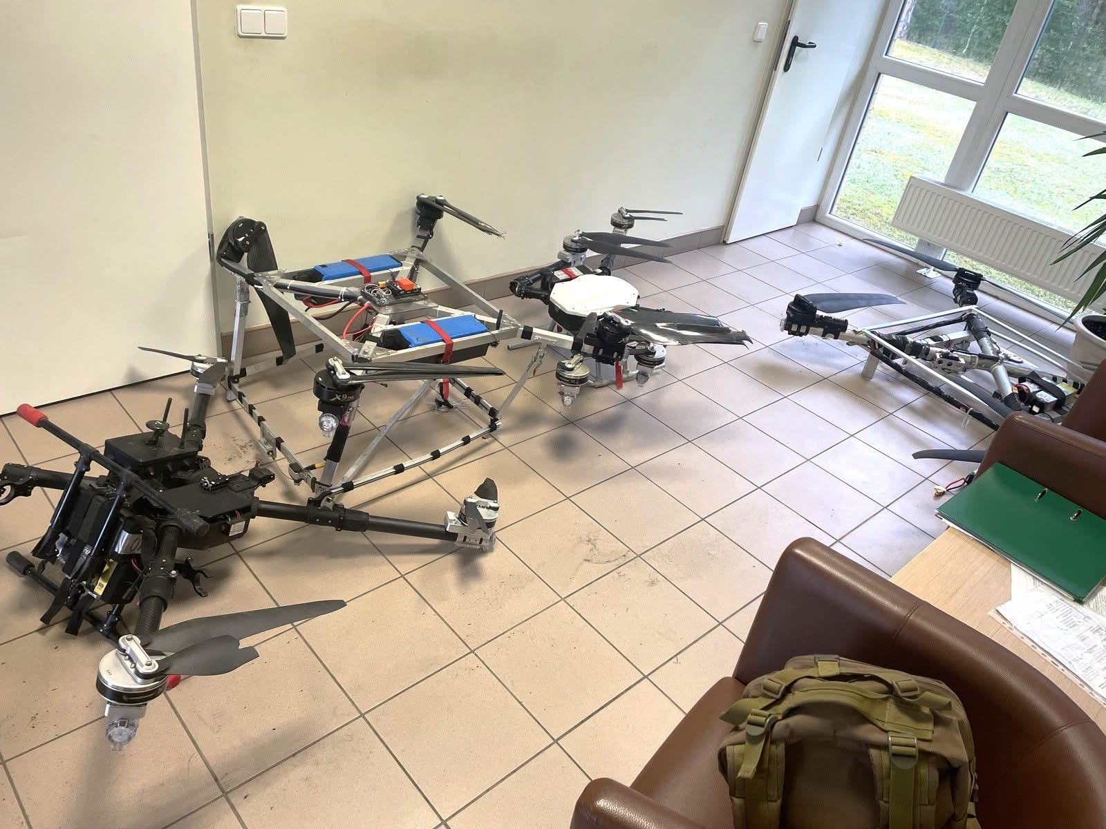 Seized contraband drones laid out during post-interception documentation at Druskininkai outpost